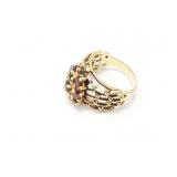 6.8g 14k yg with several red chips;