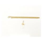 3.4g unmkd gold cross with gold toned chain;