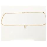 7.4g 14k yg herringbone chain with E charm;