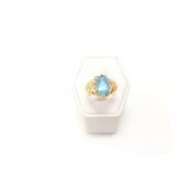 4.1g 14k yg ring with 1 large blue stone;