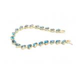 BRACELET 10K GOLD BLUE TOPAZ 9.8G