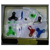 BOX OF 24 SPINNERS. VARIOUS COLORS