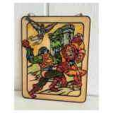 Vintage superhero artwork on plastic