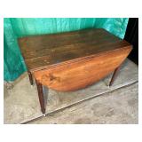 Vintage wooden drop leaf table on wheels