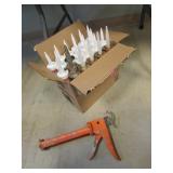box of caulking & caulking gun