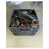 crate of metal pipes