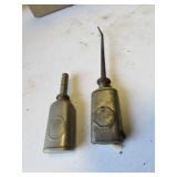 2 small film oil cans