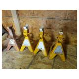 4 yellow car jacks