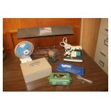 fan,pencil sharpener,desk lamp & items