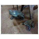 2 concrete frogs