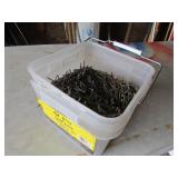 3/4 full bucket of nails