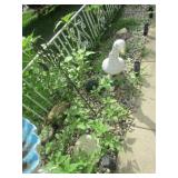 damaged concrete goose & yard decorations