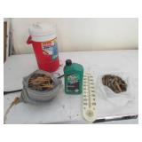 clothes pins,thermometer,full jug of oil,cooler