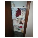 towels,linens & wall hangings in closet