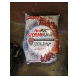 bag of snow & ice melt & yellow container