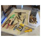 container,tape measure,squares,tools,items