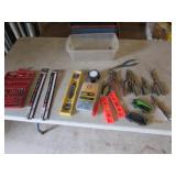 container,,level,saw blades,pliers,bit set,tools