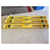 three yellow 2 ft levels