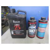3 partial jugs of gun powder