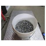 68 lbs of lead bullet tips in white bucket