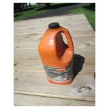 stihl half full jug of bar & chain oil