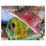 2 full bags of soil & plastic barrel