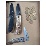 Assorted Folding Knives and Arcade Tokens