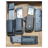 Assorted Pistol Magazines and Holsters