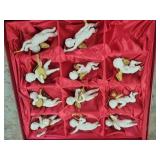 Set of Nine Porcelain Cherub Ornaments with Gold A