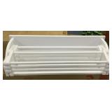 White wooden fold out towel rack