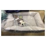 Plush pet bed with squeek toy