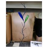 iron bottle trees with bottles