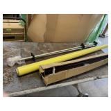 Roll of Yellow Paper and 2x Curtain Rods