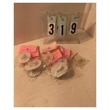 8 small white cowboy hats