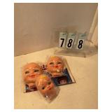 3 baby doll heads