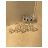 6 glass candle sticks and 2 votive cups