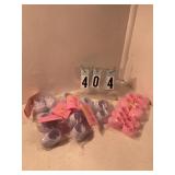 8 pair of white and 6 pair of pink baby shoes