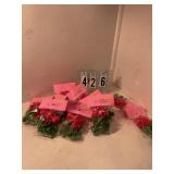 11 pkgs of 12 red and green bow rings for