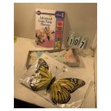 Cake decorating book and assorted butterflies