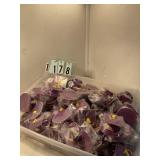 Approximately 60 Purple graduation caps