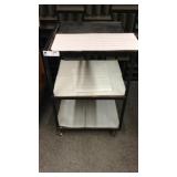 Three shelf metal cart on casters