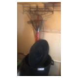 Yard rakes and a trashcan