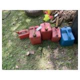 5 Gas cans, various sizes.