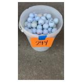 LARGE LOT OF GOLF BALLS IN BUCKET