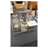 LOT OF 4 OLD PETROLEUM BOTTLES W/ STORAGE RACK LOT OF 4 OLD PETROLEUM BOTTLES W/ STORAGE RACK
