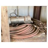 contents of bottom shelf: chemicals, hose,