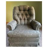 Green floral upholstered swivel rocking chair