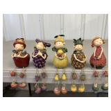 5 anthropomorphic  fruit shelf sitters