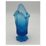 Blue glass floral pattern handkerchief vase.