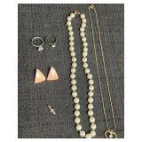 2 necklaces, pair of earrings, 2 rings, cross